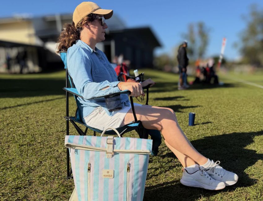 A stylish insulated cooler bag at a sunny Australian sports day