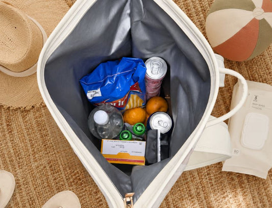 Cooler backpack packed full with cold drinks, snacks and food for a full day out