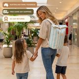 Sunza Original cooler backpack in Seafoam Mist worn by a mum walking through a shopping centre holding her two children's hands — Australian family business, free same-day shipping, 30-day returns.