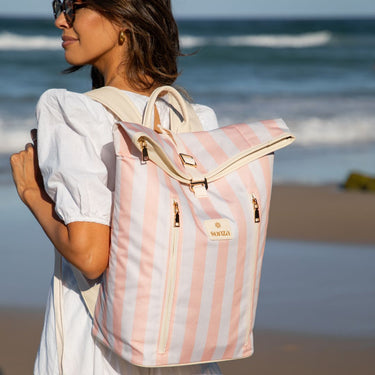 Woman wearing Sunza Original Cooler Backpack in Sunset Blush at the beach — insulated cooler backpack for women Australia